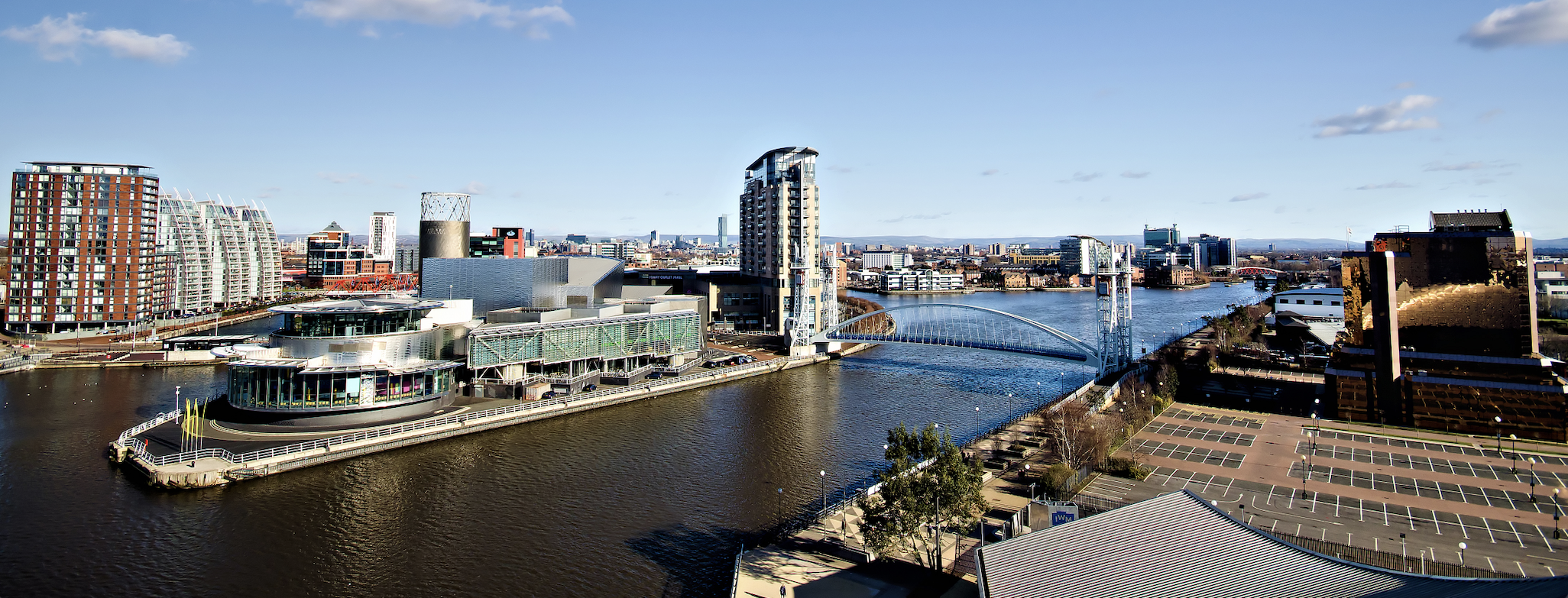 Modern buildings and bridge at Salford Quays, Greater Manchester, England, UK.